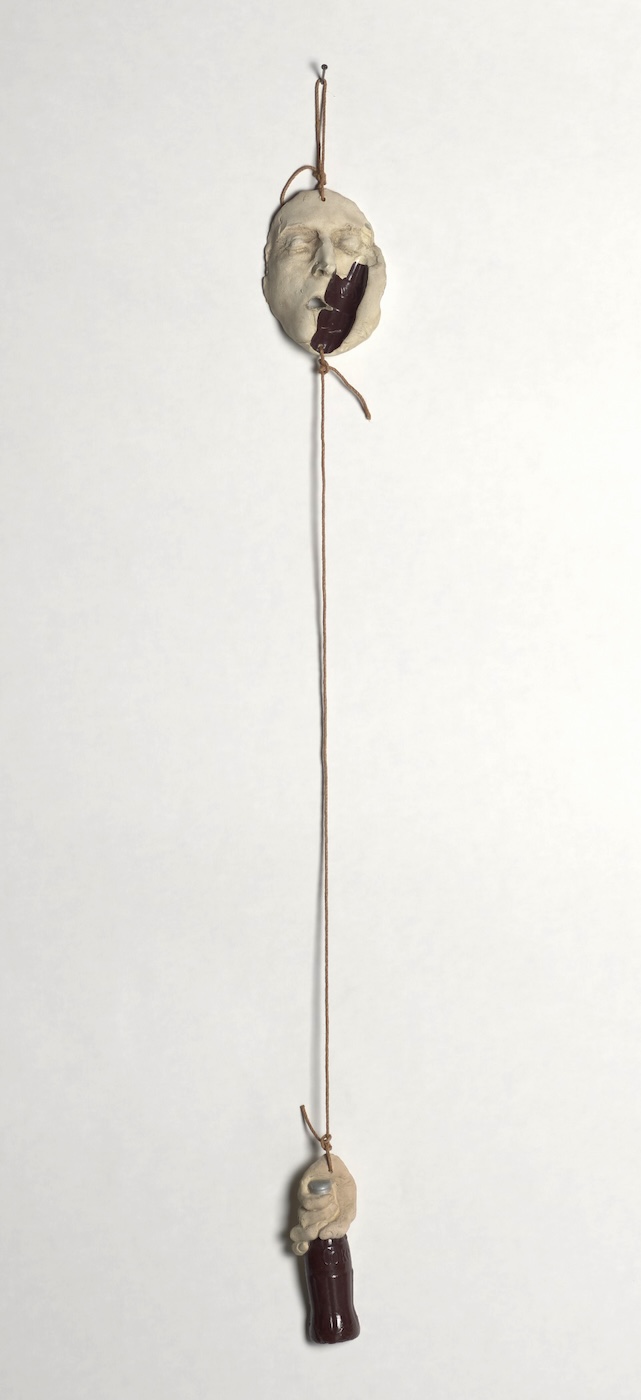 18_FaceAndHandWithCoca-ColaBottle