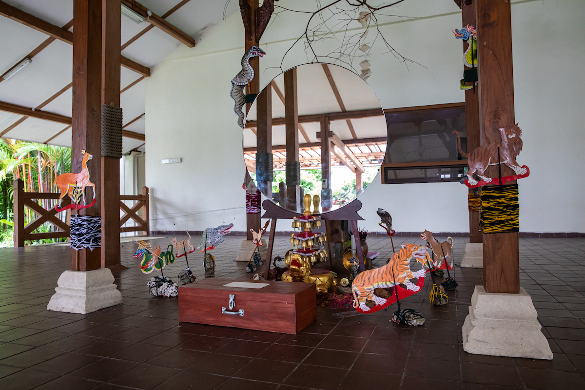 Installation-view-of-Zarina-Muhammads-Moving-Earth-Crossing-Water-Eating-Soil-2022-as-part-of-Singapore-Biennale-2022-named-Natasha.-Image-courtesy-of-Singapore-Art-Museum-1-2000x0